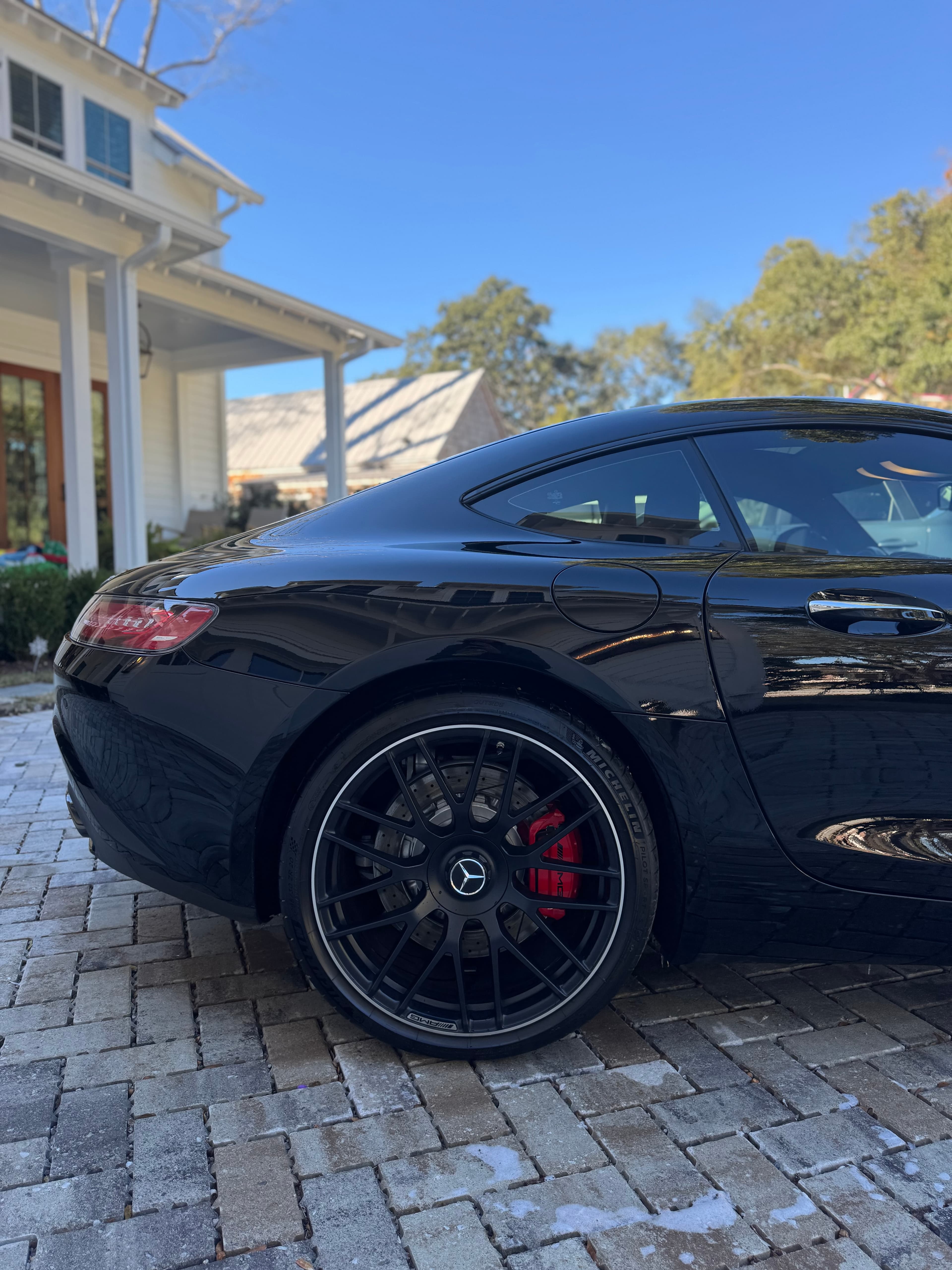 Black Mercedes-AMG GT rear quarter and wheel, mobile detailing in Charleston, SC by Moonshine Detailing