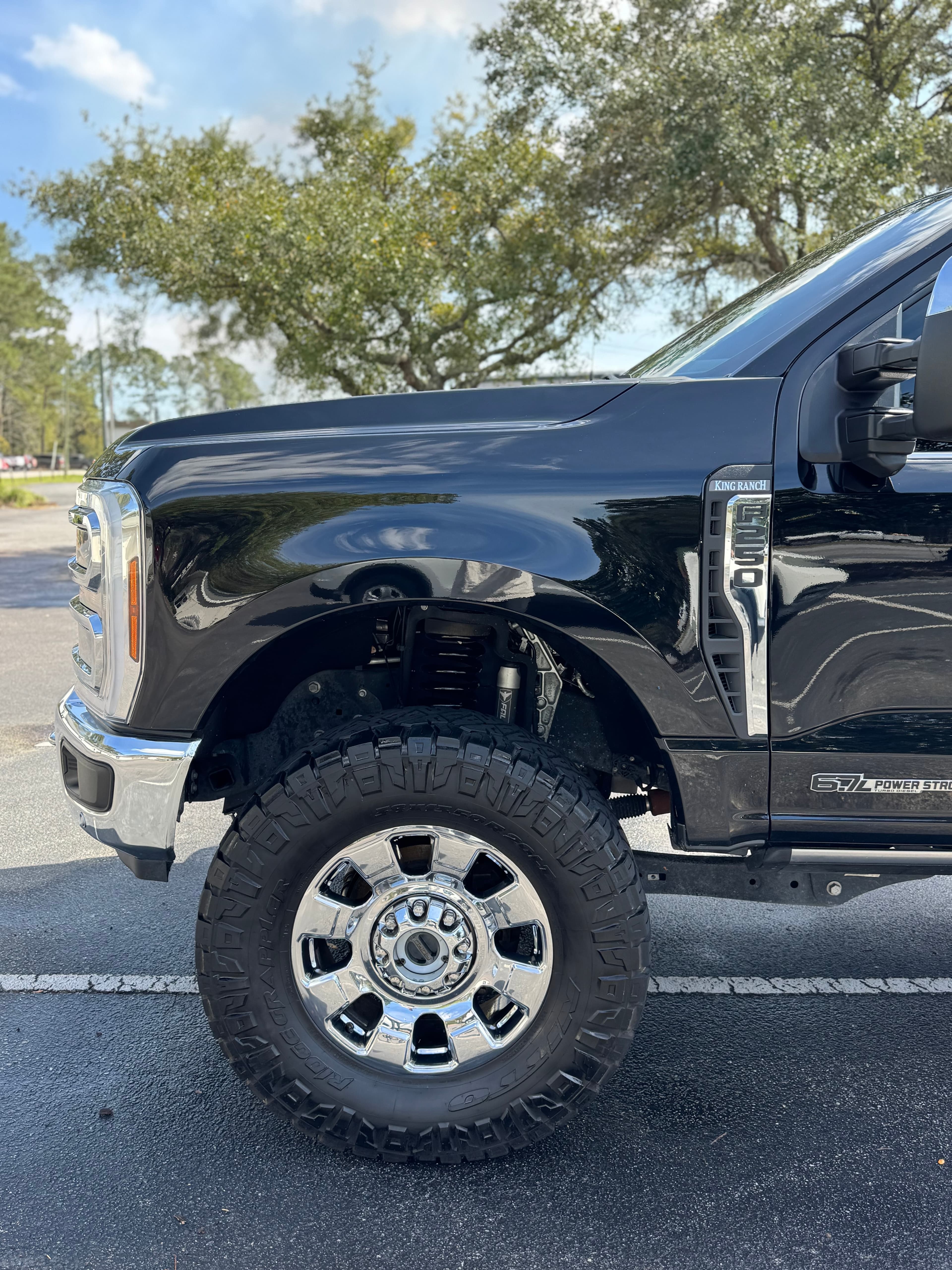 Black Ford F-250 Powerstroke truck front fender, mobile detailing in Charleston, SC by Moonshine Detailing